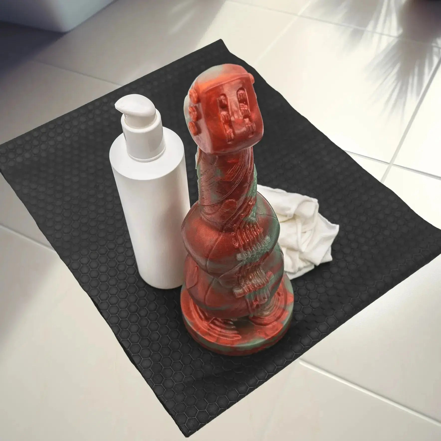 G-Sting Advanced Knotted Dildo lifestyle next to lube bottle