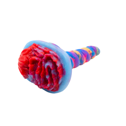 Stinger the Jelly Handheld Sex Toy Grinder suctioned to base of dildo