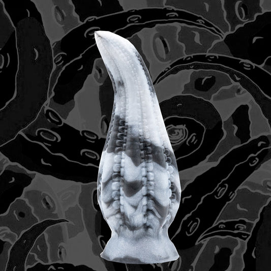 DAKKEN is a tentacle dildo. A girthy, full-bodied fantasy dildo in the shape of an octopus' tentacle. The DAKKEN tentacle dildo has small suckers running down the insides of each tentacle -- adorning you with a ribbed sensation.